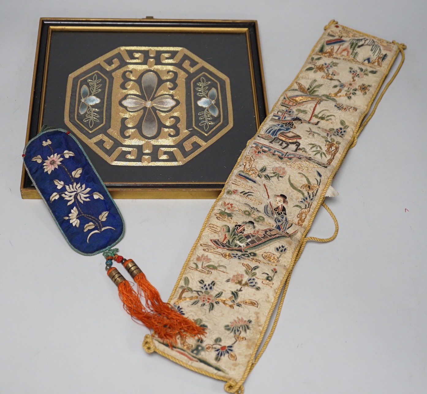 A pair of Chinese 19th century figurative sleeve bands, embroidered with polychrome and metallic threads, stitched in Peking knot and a Chinese embroidered silk purse, with a later panel, (3)